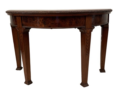 Lot 34 - A Continental walnut demi-lune console table