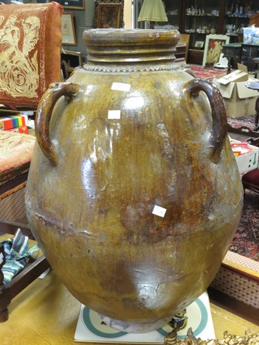 Lot 105 - A large oriental brown glazed jar with four...