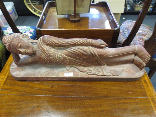 Lot 114 - A carved and red stained wood figure of a...