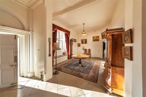 Lot 4 - A pair of carved high back hall chairs, with...