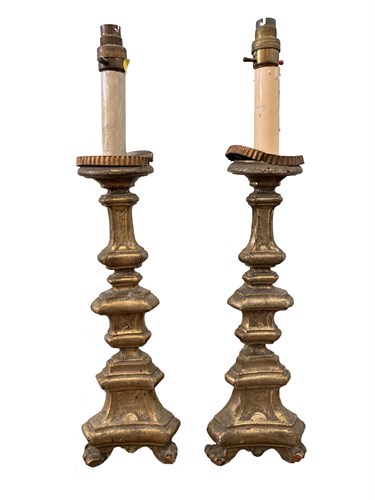 Lot 67 - A pair of Continental carved gilt wood pricket...