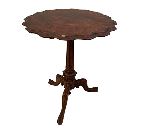 Lot 66 - A mid Victorian figured walnut tripod...