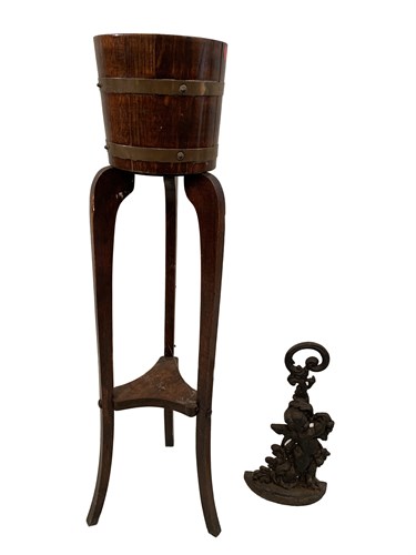 Lot 3 - A cast iron door stop of a Cherub, together...