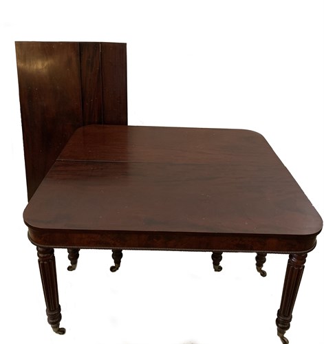 Lot 24 - A Regency mahogany extending dining table in...