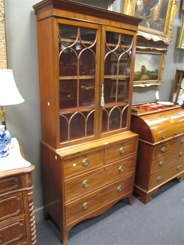 Lot 631 - A George III mahogany glazed bookcase on chest...