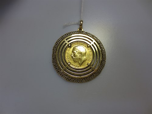 Lot 288 - A pendant of concentric rings claw set with a...