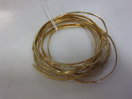 Lot 309 - A collection of ten bangles of middle/far...