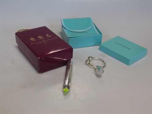 Lot 275 - A silver key ring by Tiffany in the original...