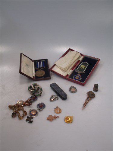 Lot 162 - Two 9ct gold medals together with a gate...