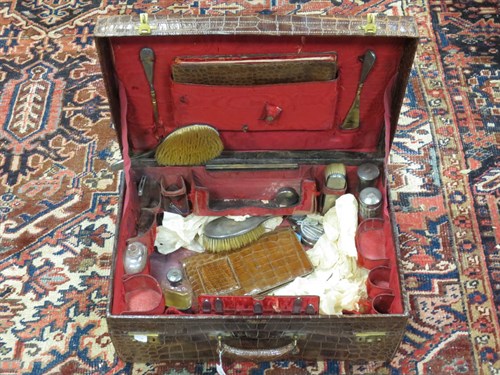 Lot 100 - A Harrods crocodile skin travelling dressing...