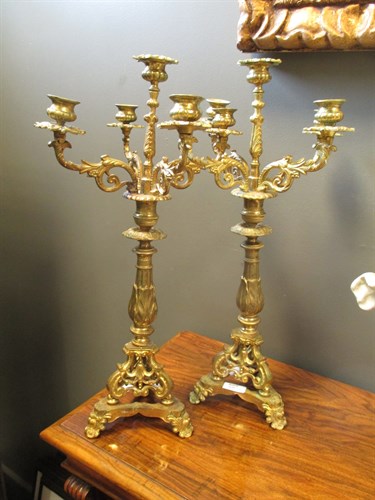 Lot 636 - A pair of ornate brass candelabra (2)