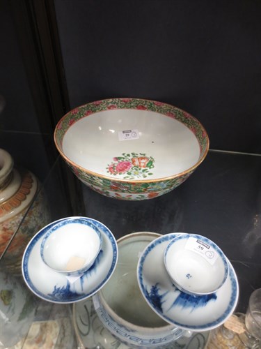 Lot 59 - A pair of Nanking Cargo cups and saucers...