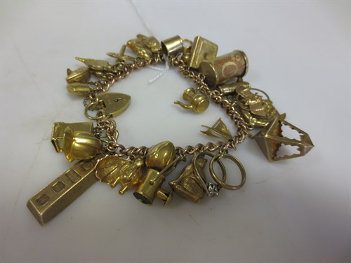 Lot 304 - A 9ct gold charm bracelet