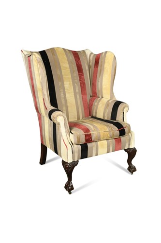 Lot 533 - A George III style wing back chair