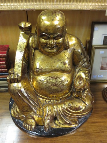 Lot 93 - A 20th century gilt wood Buddha, 51cm high