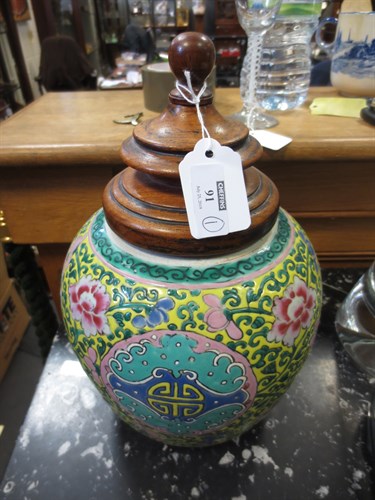 Lot 91 - A Chinese ginger jar with turned wooden cover