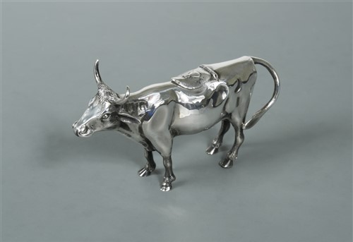 Lot 313 - An Italian metalwares silver semi naturalistic cow creamer