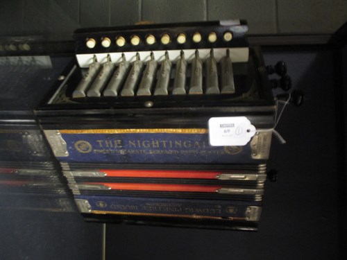 Lot 69 - An accordian