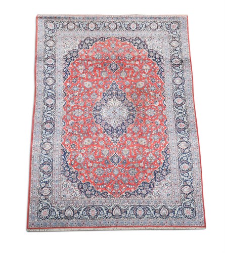 Lot 690 - A Tabriz madder ground carpet, 440 x 290 cm