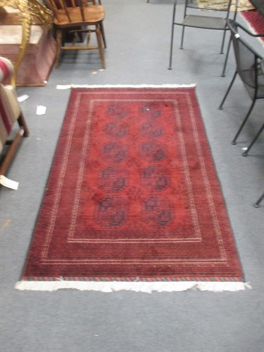 Lot 740 - A small red Beluchi rug, 186 x 113cm