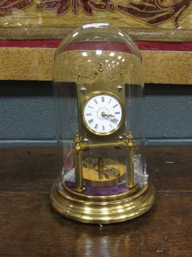 Lot 131 - Three aniversary clocks with domes, one with...