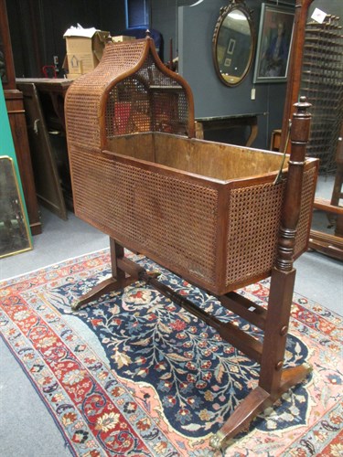 Lot 684 - A Regency mahogany bergere cradle, with later...