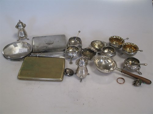 Lot 372 - A collection of silver shell salts, peppers,...