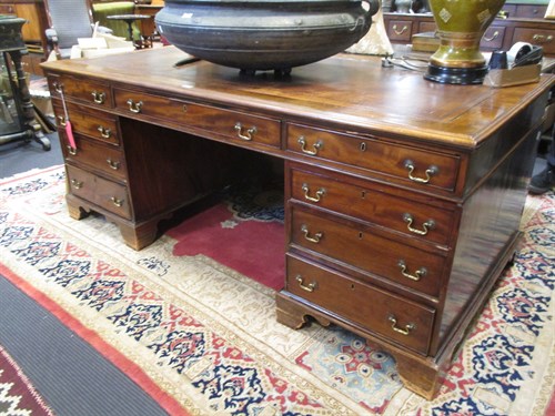 Lot 321 - An Edwardian Mahogany partners pedestal desk...