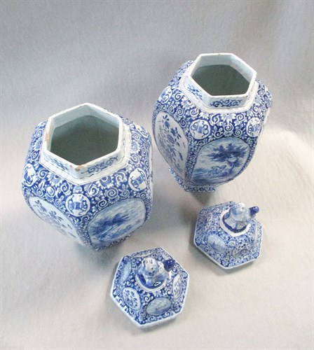Lot 39 - A pair of Dutch Delft blue and white vases and covers, 19th century
