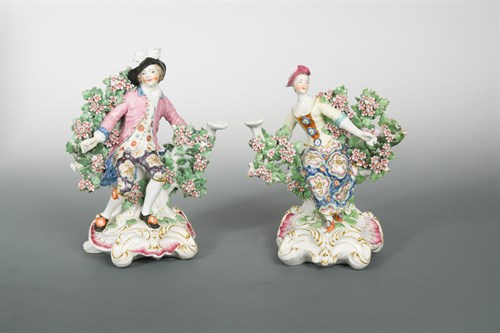Lot 19 - A pair of Chelsea bocage figural candlesticks, circa 1762