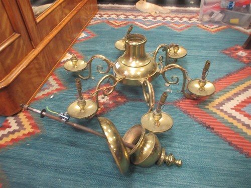 Lot 433 - A six branch brass chandelier