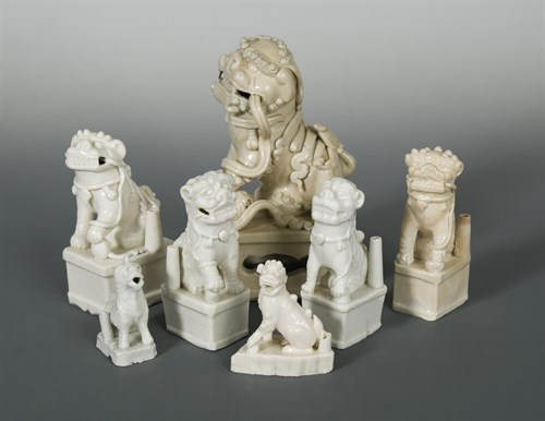 Lot 87 - A group of six Chinese Dehua Fo-Dog joss-stick holders, Qing Dynasty