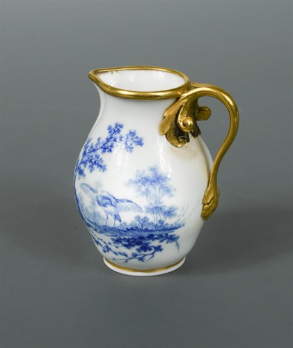 Lot 63 - A Sevres ormolu mounted cream jug