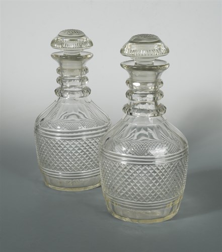 Lot 31 - A pair of cut glass mallet shaped magnum decanters with later stoppers