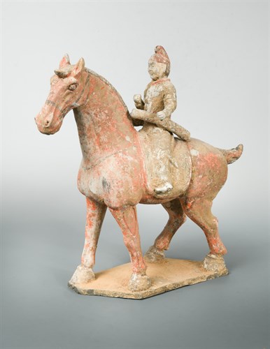 Lot 93 - A painted pottery figure of a horse and rider, possibly Tang Dynasty