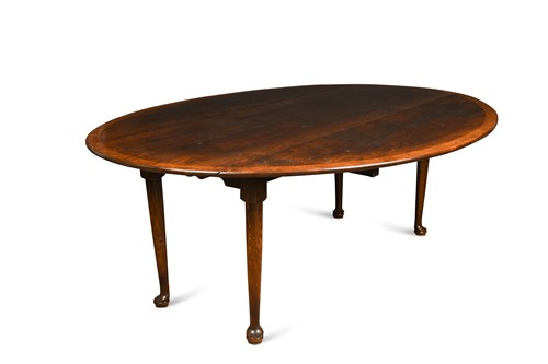 Lot 538 - A large oak crossbanded drop leaf dining table, 20th century 