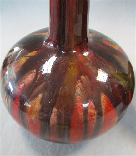 Lot 21 - A pair of Burmantofts bottle vases, possibly designed by Dr Christopher Dresser