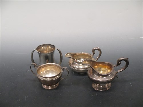 Lot 183 - Two silver cream jugs and two silver two...