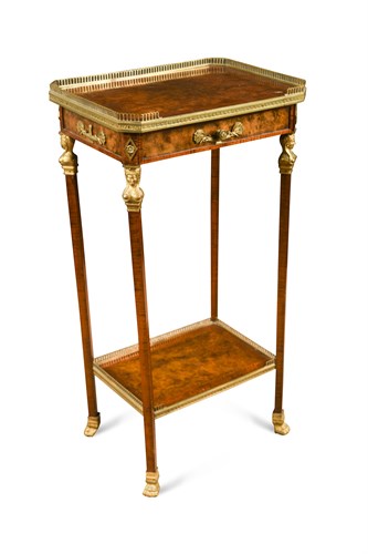 Lot 551 - A French Empire style walnut and kingwood banded side table