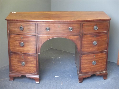 Lot 679 - A Regency mahogany bow front dressing table,...