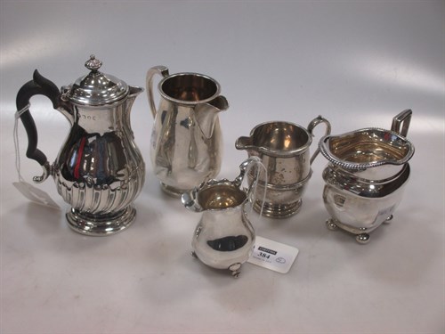 Lot 384 - A collection of 5 silver milk and cream jugs,...
