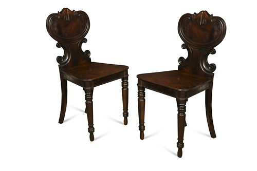 Lot 531 - A pair of Regency mahogany hall chairs