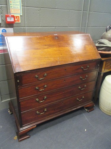 Lot 572 - A George III mahogany bureau with fitted...