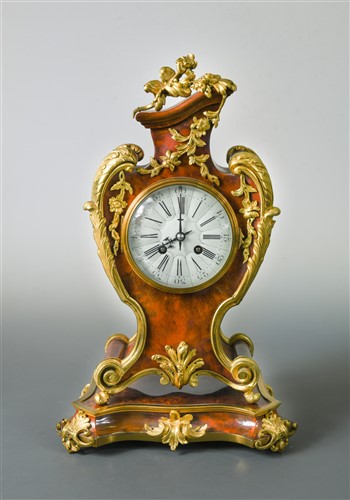 Lot 380 - A French tortoiseshell and ormolu mounted mantel clock