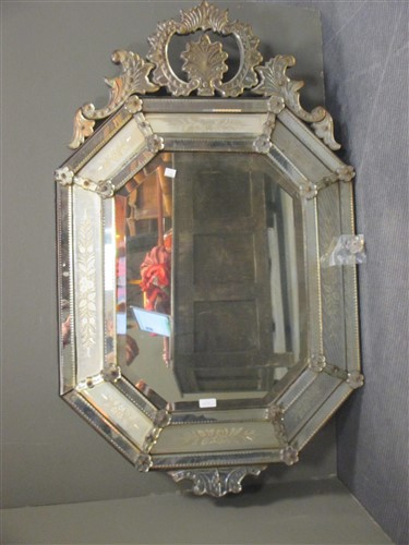 Lot 415 - A Venetian wall mirror, engraved with marginal...