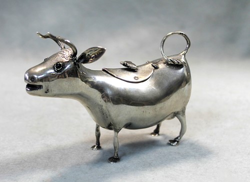 Lot 319 - A Dutch metalwares silver Shuppe style cow creamer
