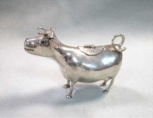 Lot 318 - A German metalwares silver Schuppe style cow creamer
