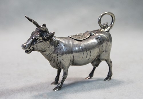 Lot 314 - A German metalwares silver miniature semi naturalistic cow creamer