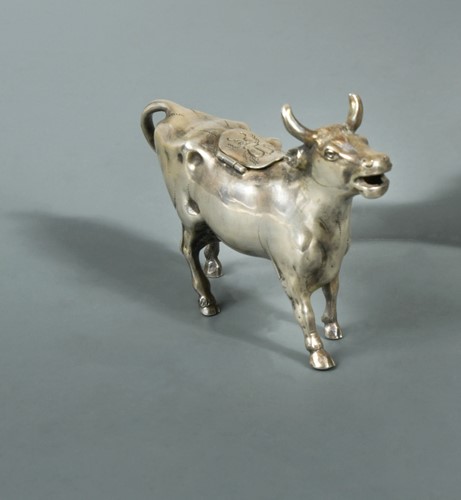 Lot 317 - A German metalwares silver semi naturalistic cow creamer