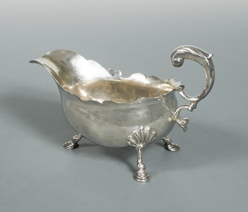 Lot 448 - A George II silver sauce boat